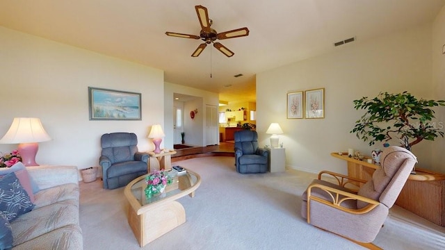 living room with carpet and ceiling fan