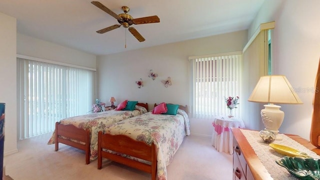 bedroom with light colored carpet and ceiling fan