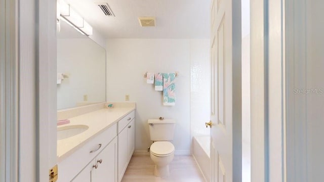 full bathroom with bathtub / shower combination, toilet, and vanity