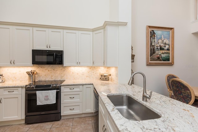 kitchen featuring light tile flooring, backsplash, dishwashing machine, electric range oven, and sink
