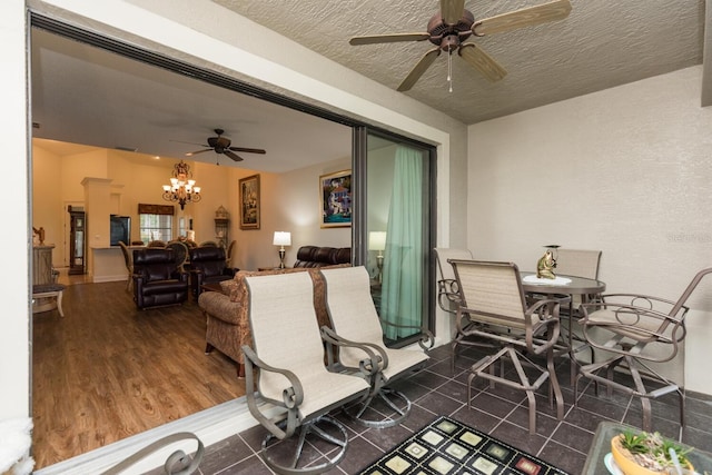 view of patio featuring ceiling fan