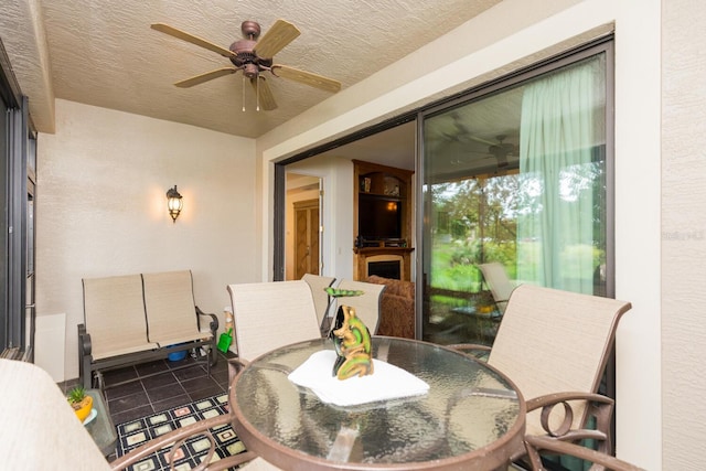 view of patio featuring ceiling fan