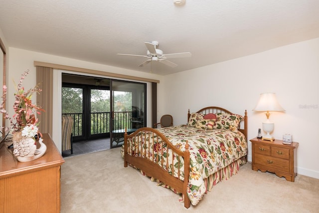 carpeted bedroom featuring ceiling fan, access to exterior, french doors, and a textured ceiling