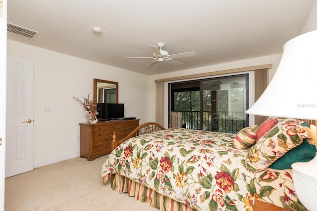 bedroom featuring carpet floors, ceiling fan, a textured ceiling, and access to outside
