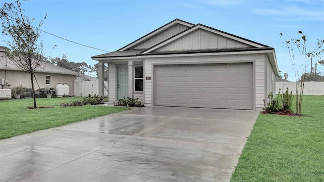 view of front of house featuring a garage and a front lawn