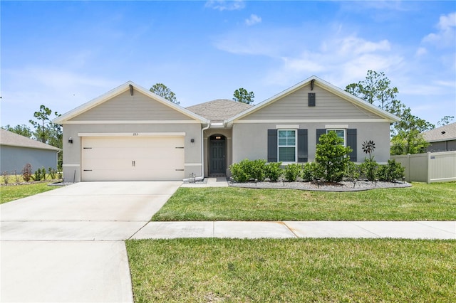 ranch-style house featuring a garage and a front lawn