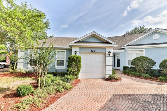 single story home with a garage