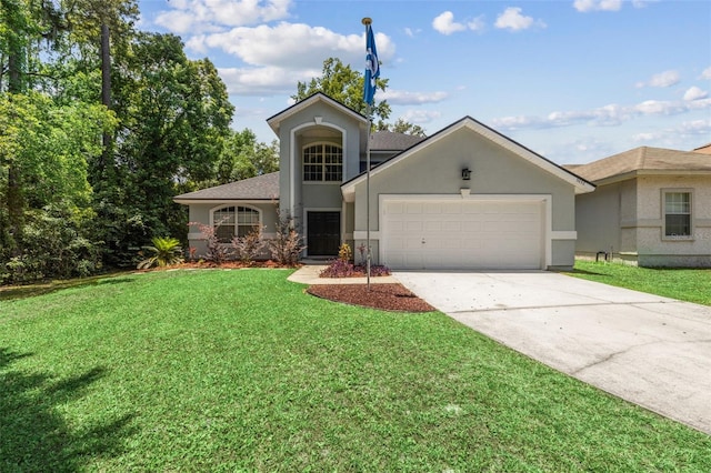 view of front of home featuring a garage and a front yard