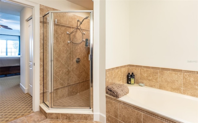 bathroom with separate shower and tub and tile patterned floors