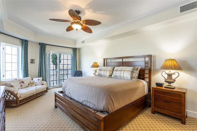 carpeted bedroom featuring ceiling fan and ornamental molding