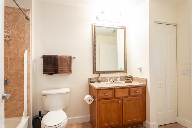 full bathroom featuring toilet, vanity, and tiled shower / bath combo