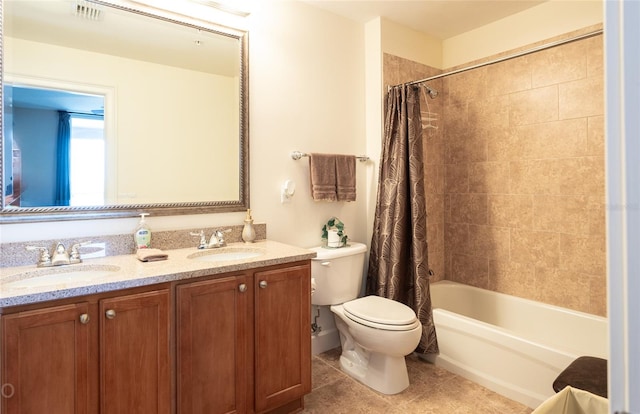 full bathroom featuring shower / bathtub combination with curtain, tile patterned floors, vanity, and toilet