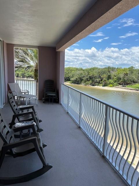 balcony featuring a water view