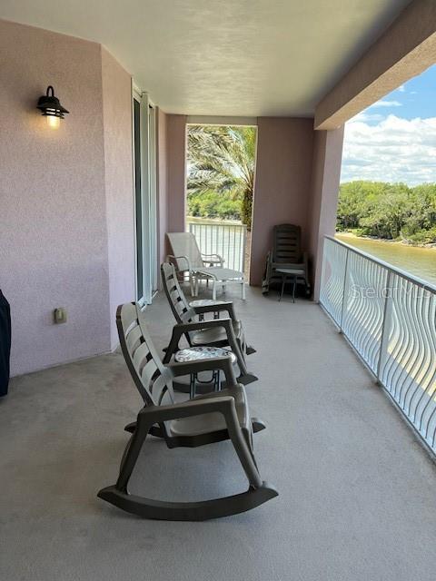 balcony featuring a water view