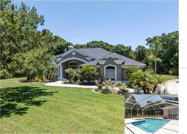 view of front facade featuring a front yard and glass enclosure