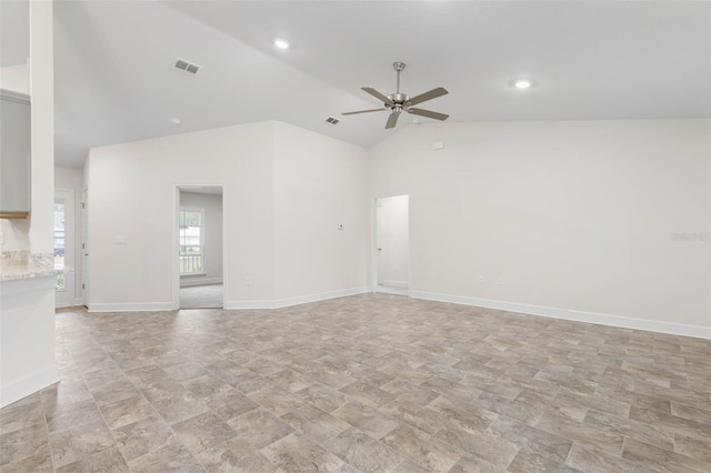 spare room featuring high vaulted ceiling and ceiling fan