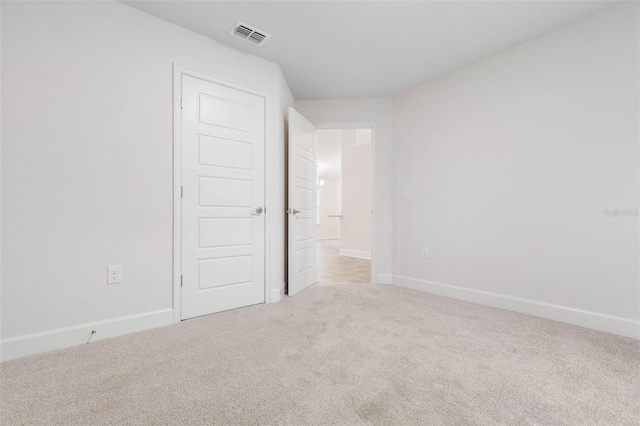 unfurnished bedroom featuring light colored carpet