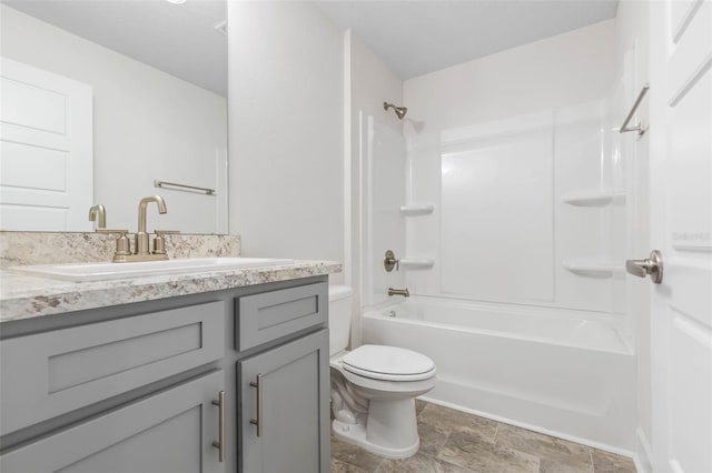 full bathroom featuring  shower combination, vanity, and toilet