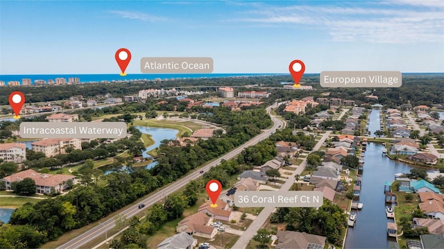 birds eye view of property featuring a water view