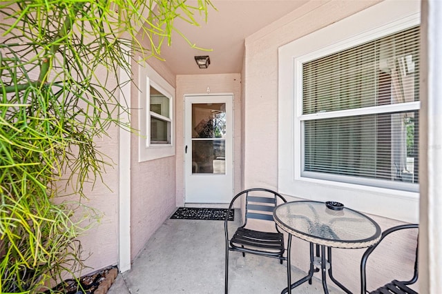 property entrance featuring a patio area