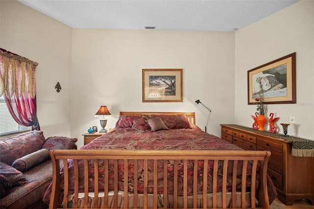 bedroom featuring a textured ceiling