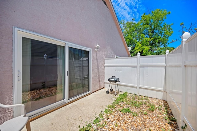 view of patio with a grill