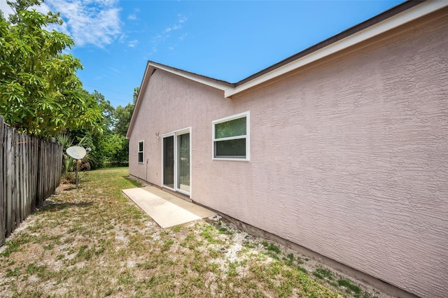 view of home's exterior featuring a yard