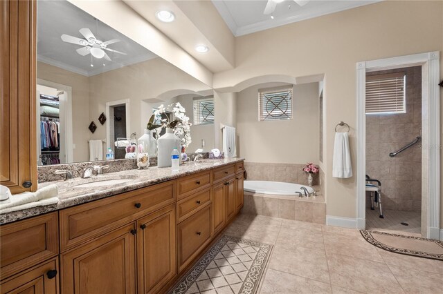 bathroom featuring ornamental molding, plus walk in shower, tile floors, ceiling fan, and oversized vanity