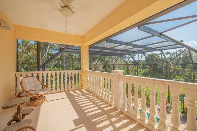 exterior space with a lanai and ceiling fan