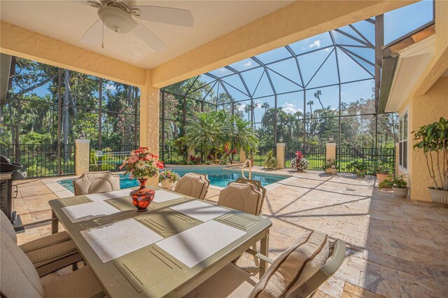 view of patio / terrace featuring ceiling fan, a lanai, and a fenced in pool