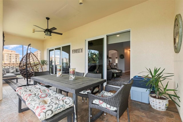 view of patio with outdoor lounge area and ceiling fan