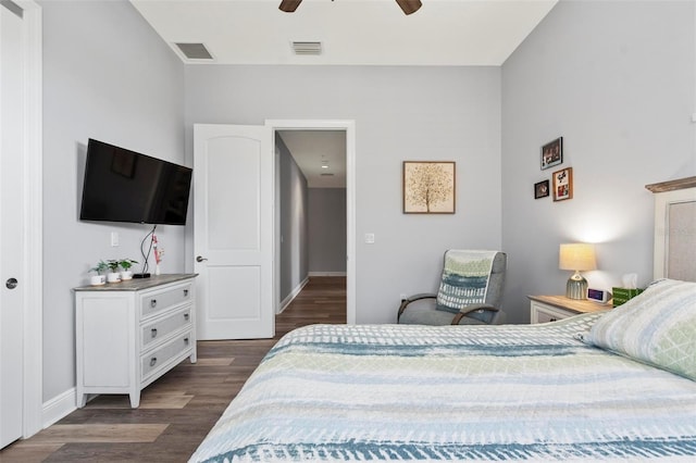 bedroom with ceiling fan and dark hardwood / wood-style flooring