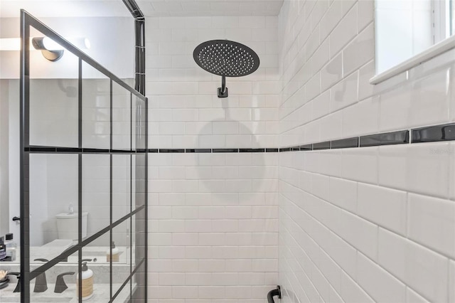 bathroom with a tile shower