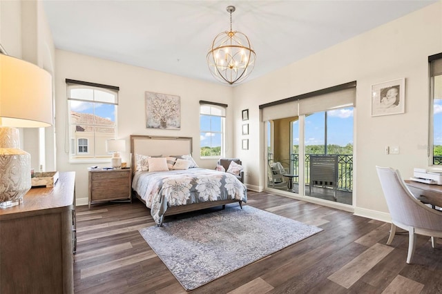 bedroom with access to outside, an inviting chandelier, and dark hardwood / wood-style flooring
