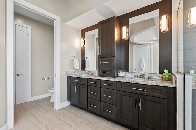 bathroom featuring toilet and vanity