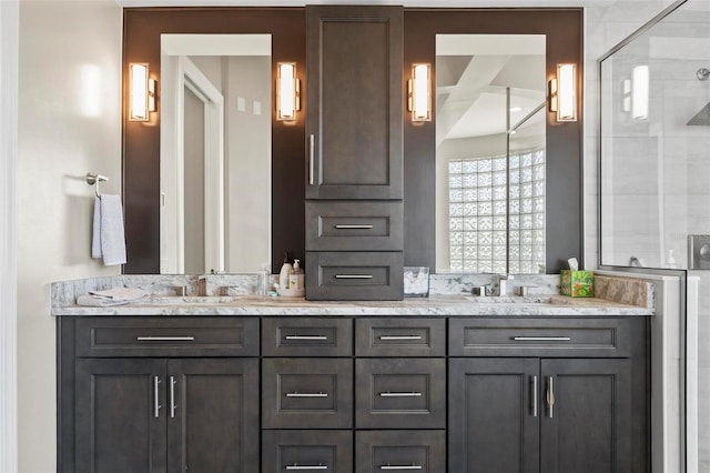 bathroom featuring an enclosed shower and vanity