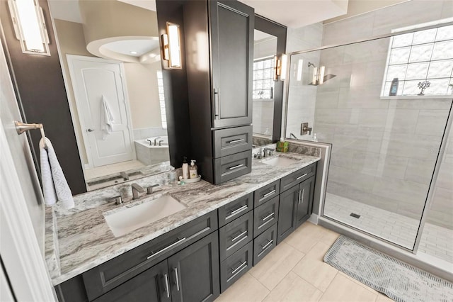 bathroom with plus walk in shower, tile patterned flooring, and vanity