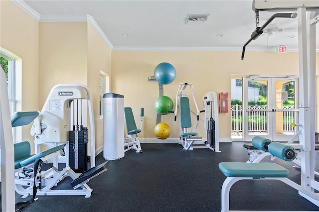 workout area featuring french doors and crown molding