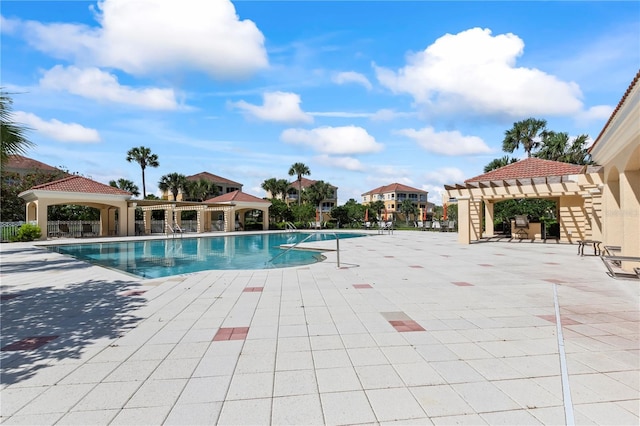 view of pool featuring a patio and a gazebo