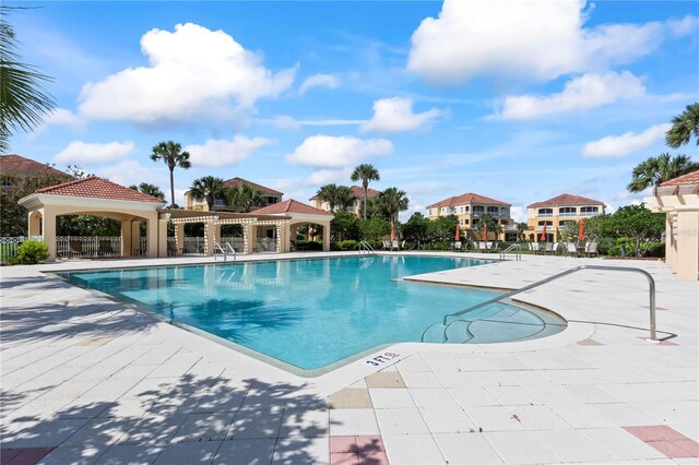 view of swimming pool with a patio area and a gazebo