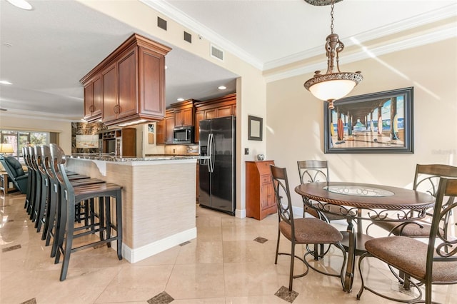 kitchen with kitchen peninsula, black refrigerator with ice dispenser, crown molding, stone counters, and light tile patterned flooring