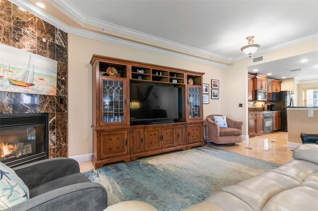 tiled living room with a fireplace and ornamental molding