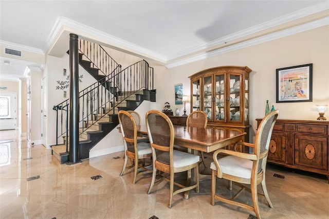 dining area with ornamental molding