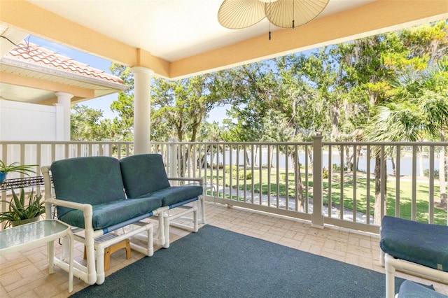 balcony with ceiling fan and an outdoor hangout area