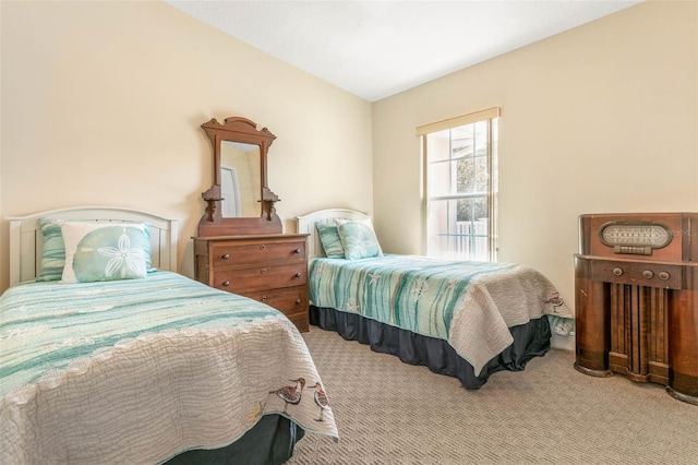 bedroom featuring light colored carpet