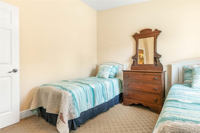 bedroom featuring light colored carpet