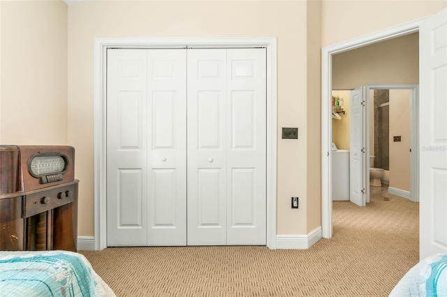 carpeted bedroom featuring a closet