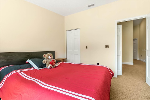 carpeted bedroom with a closet