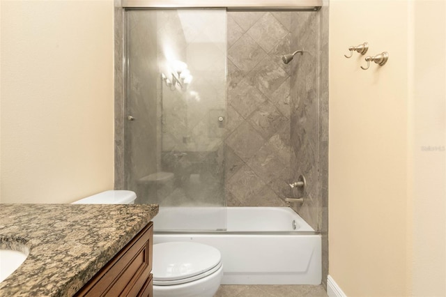 full bathroom with combined bath / shower with glass door, vanity, and toilet