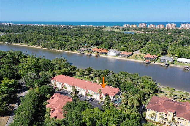 birds eye view of property featuring a water view